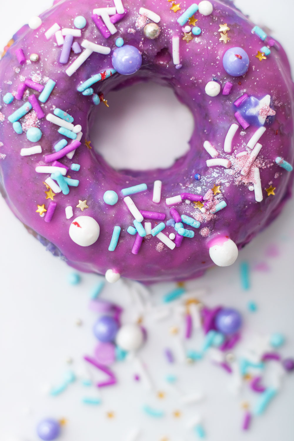 Sparkling sprinkles with pink and purple glaze, these Unicorn Sprinkle Doughnuts are perfect for National Doughnut Day (which is every day, obviously).