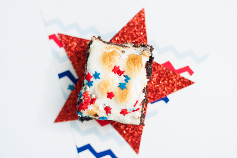 Marshmallow, brownie, graham crackers, chocolate chips, and sprinkles. S'mores Brownie Bars, just as messy as the original and twice as delicious. Oh, and red, white, and blue sprinkles for the 4th of July.