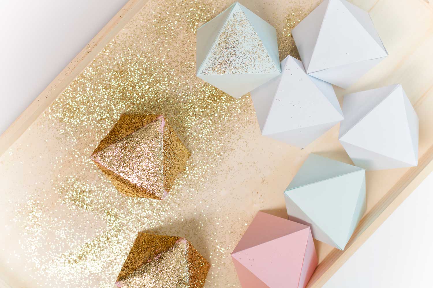 Treat your inner math nerd to some craft time. This DIY Glitter Octahedron Garland is quick and easy to make while also adding some sparkle to your walls.